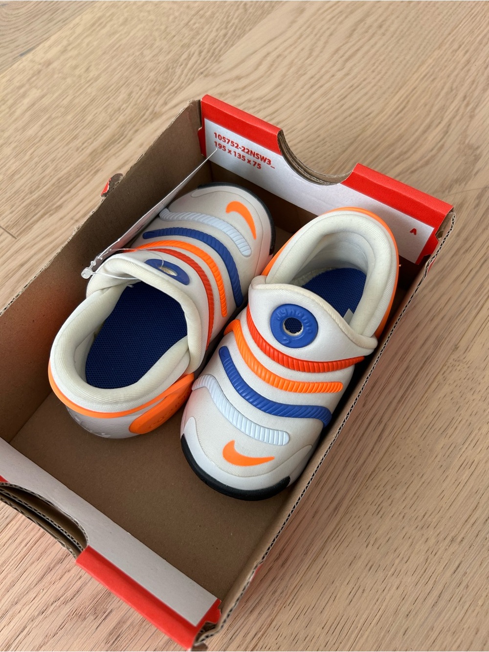 Nike Baby Slip-On Walkers in White with Orange & Blue Accents